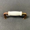 3" Flare Foot Antique Copper Pull With White Ceramic Insert