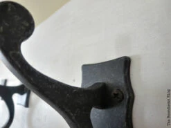 Brainerd Double Scroll Hook, Tumbled Dark Gunmetal LQ-111444 -D'Lawless Hardware Shop hook closeup 1 67016.1660077177